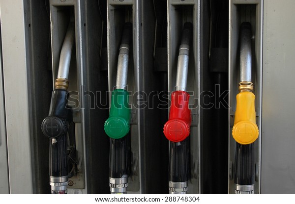 Color full\
gasoline pump guns at petrol\
station