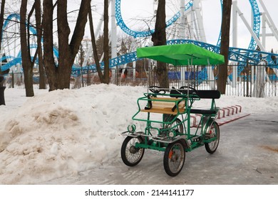 Color, Green, Double, Empty, Parked Surrey Bike For Rent.