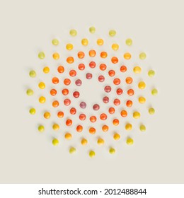 Color harmony with wild plums concentric circles isolated on beige background. Minimal colorful summer fruit flat lay. Nature, abstract note card food pattern. Circular shape frame with copy space. - Powered by Shutterstock