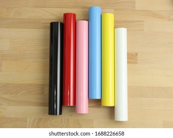 color heat transfer vinyl rolls over wood table