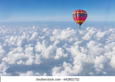 Color Hot Air Balloon In Blue Sky With Clouds Closeup