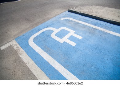 Color Image Of A Parking Spot For Electric Cars.