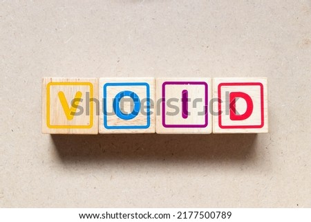 Color letter block in word void on wood background