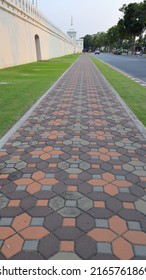 Color Long Paved Brick Footpath, Brick Path Or Sidewalk With Perspective Going Into The Distance, Abstract Background Of Tiles, Footpath, Sidewalk In Portrait Orientation.