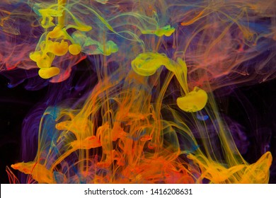 Color Paint Drops In Water. Ink Swirling Underwater. Cloud Of Silky Ink Collision On Black Background. Colorful Abstract Smoke Explosion Animation. Close Up Camera View.