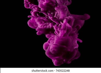 Color Paint Drops In Water. Ink Swirling Underwater. Cloud Of Silky Ink Collision On Black Background. Colorful Abstract Smoke Explosion Animation. Close Up Camera View.