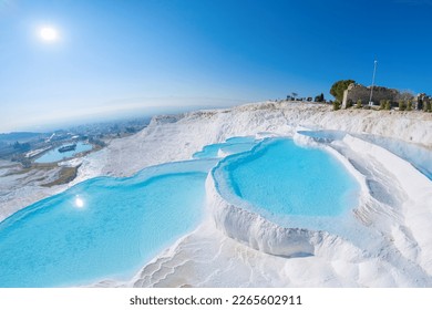 Color Pamukkale Turkey travertine pools, nature terraces with blue water, Aerial top view.