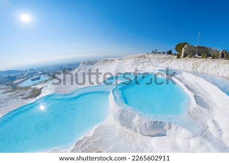 Color Pamukkale Turkey travertine pools, nature terraces with blue water, Aerial top view.