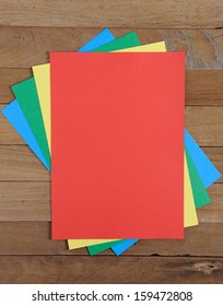 Color Paper  On Wood Background