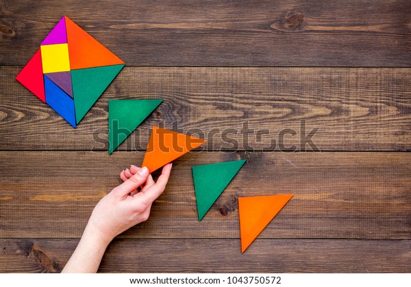 color paper pieces for business puzzle
wooden table background top view space for
text