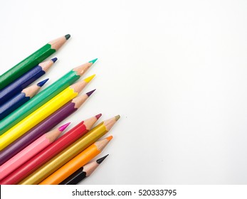 Color pencils on white background, copy space