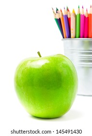 Color Pencils In Tin Can Or Pencil  Holders And Great  Green Apple, Back To School Supplies Closeup