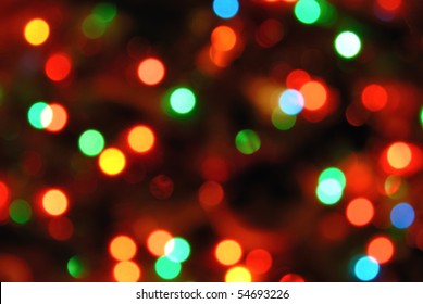 Color photo of blurred Christmas lights at night