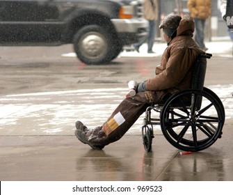 Color Photo Of A Homeless Man In A Wheelchair