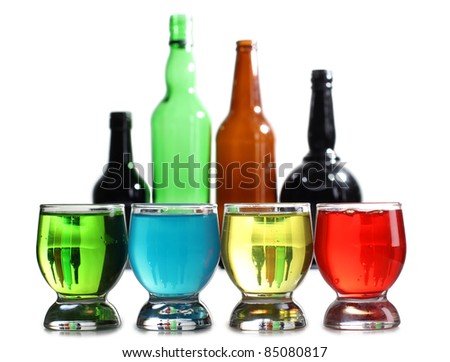 Color photograph of bottle and cocktails in glass beakers