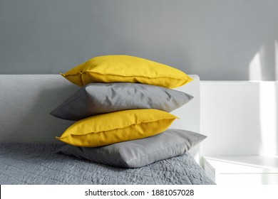 Color pillows illuminating ultimate gray pile on bed Two trendy 2021 colors of years Modern interior design Cozy textile Sweet home - Shutterstock ID 1881057028