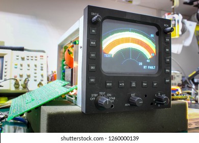 Color  RADAR indicator of weather radar  ,Avionics equipment in aircraft with maintenance. - Shutterstock ID 1260000139