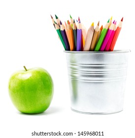 Color Rainbow  Pencils In Tin Can Or Pencil  Holders And Green Apple, Back To School Supplies Closeup