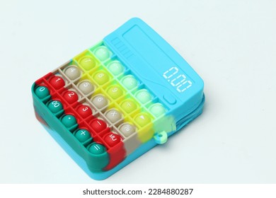 Color sensor toy shape like calculator isolated on white background.Anti stress and relaxation concept. - Shutterstock ID 2284880287