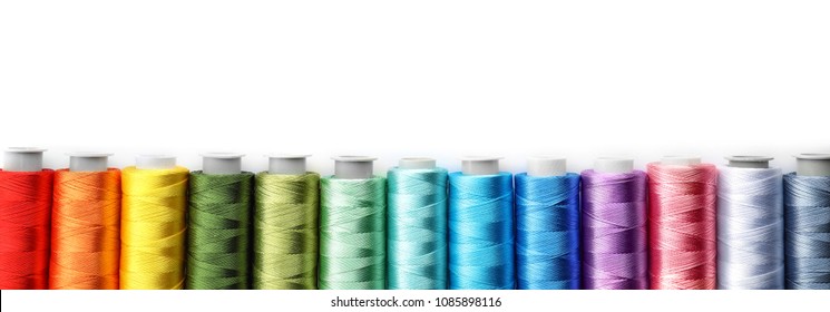 Color sewing threads on white background, top view - Shutterstock ID 1085898116