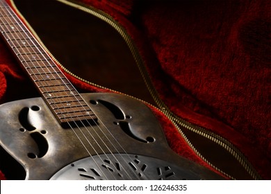 Color Shot Of A Vintage Guitar In A Case