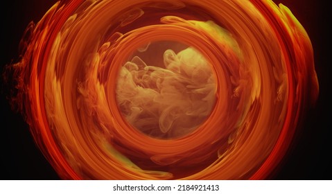 Color smoke circle. Ink water swirl. Fire flame vortex. Orange red yellow fume in round burning tunnel on dark black abstract background.