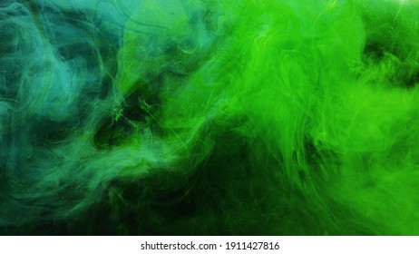 Color smoke. Neon abstract background. Paint in water explosion. Toxic air pollution. Glowing bright green glitter vapor splash mix on dark. - Shutterstock ID 1911427816