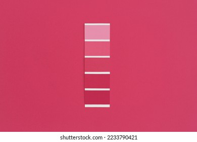 Color swatch with color of the year 2023 - Viva Magenta. Color trend palette. Top view, flat lay.