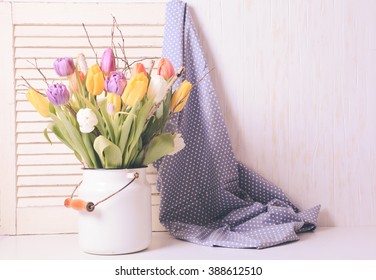 Color Tulips With Branches In A White Cane. Spring Decor