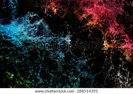 Color water splash on black background