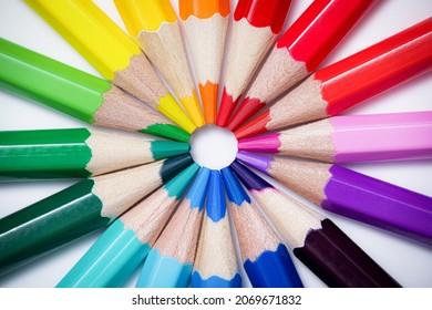 Color wheel or color theory concept with colored pencils. Colored crayons arranged in a circle against a white background. Table top view, flat lay. - Powered by Shutterstock