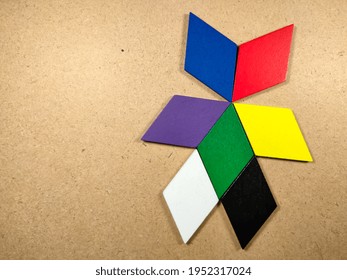 Color Wood Puzzle In Unique Robot Shape On Wood Background With Copy Space.