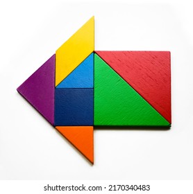 Color Wood Tangram Puzzle In Arrow Or Home Shape. Isolated On White Background. Teamwork, Brainstorming Idea, Sign, Concept. Synergy Symbol.