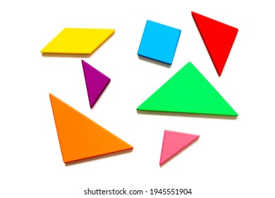 Color wood tangram puzzle in geometric shape wait to build on white background