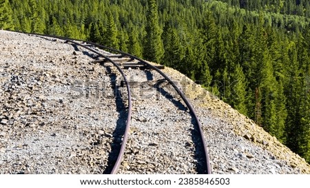 A Colorado abandoned mine's minecart rails along the Mosquito Range of the Rocky Mountains, near Alma, Fairplay, and Breckenridge, USA, in fall and autumn of 2023.