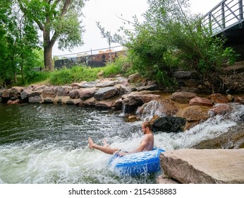 Colorado, AUG 9 2014 - People Playing Water Sports Along Boulder Creek