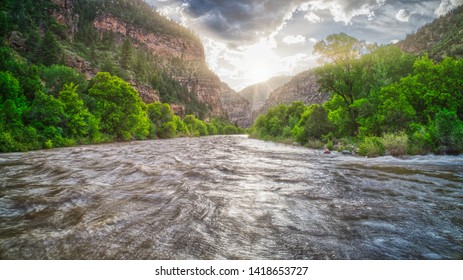 The Colorado River Flows Under A Sunset In The Glenwood Canyon In Glenwood Springs, Colorado Off Of Interstate 70. 