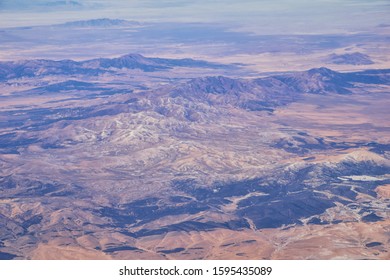 Colorado Rocky Mountains Aerial view from airplane of abstract Landscapes, peaks, canyons and rural cities in southwest Colorado and Utah. United States of America. USA. - Shutterstock ID 1595435089