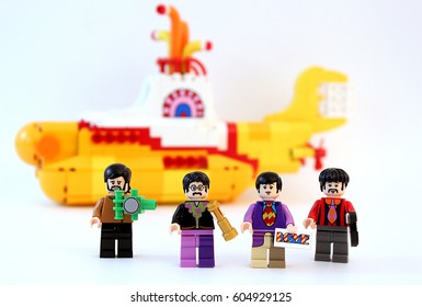 Colorado, USA - March 20, 2017: Studio shot of Lego minifigure Beatles with yellow submarine in the background.
