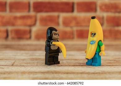 Colorado, USA - May 17, 2017: Studio Shot Of Lego Minifigure Banana Guy And Gorilla Suit Guy With Banana.