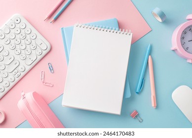 Color-coordinated desk setup featuring a pastel pink and blue theme with laptop, notebook, pens, and clock, ideal for contemporary offices and home study spaces