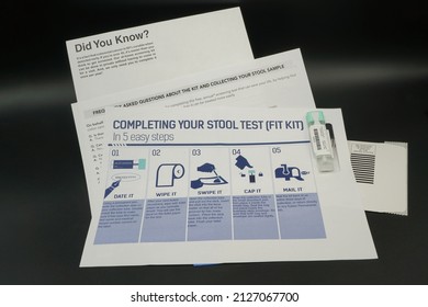 A Colorectal cancer screening test kit. Isolated on black. Healthcare, prevention. - Shutterstock ID 2127067700