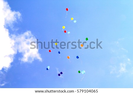 colored balloons in the sky for a background, flying balloons