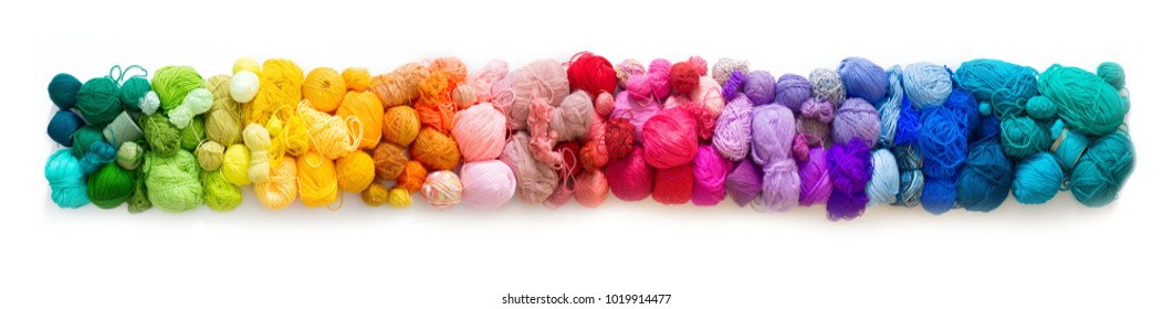 Colored balls of yarn. View from above. Rainbow colors. All colors. Yarn for knitting. Skeins of yarn.