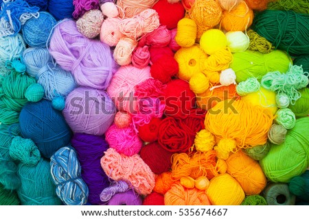 Colored balls of yarn. View from above. Rainbow colors. All colors. Yarn for knitting. Skeins of yarn.