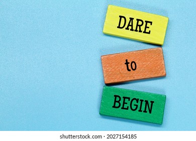 Colored Board With The Word Dare To Begin