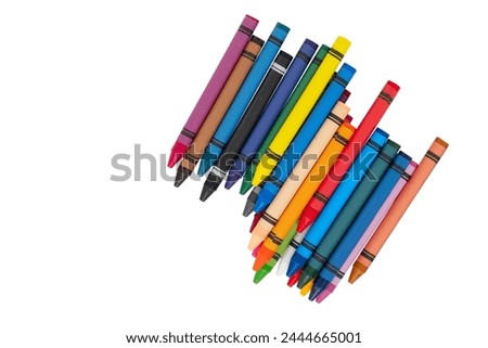 Colored crayons on a white background. New set of wax crayons for children's creativity