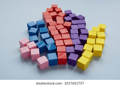 Colored cubes shaped like a pie chart with abstract data analysis and market understanding.