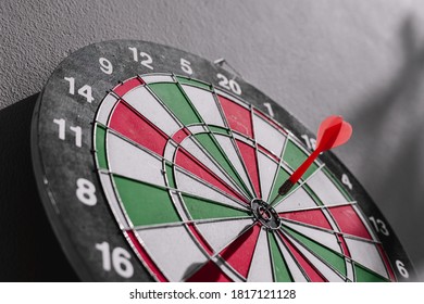 Colored darts embroidered on the target point in the middle of the red color.
 - Shutterstock ID 1817121128