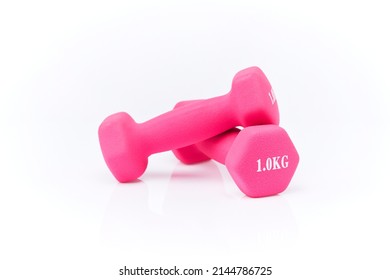 colored dumbbells isolated on white background. Pink dumbbells on a white background. Pink matte dumbbells isolated on white background. - Shutterstock ID 2144786725